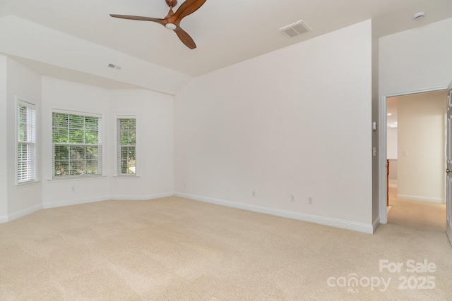 unfurnished room with baseboards, visible vents, a ceiling fan, and light colored carpet