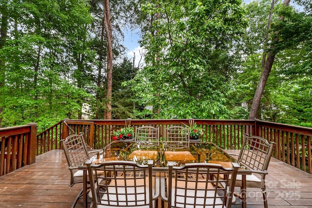 deck with outdoor dining space