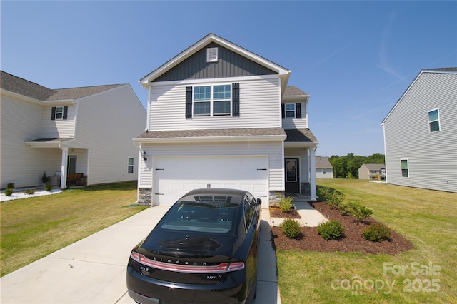 traditional home featuring a garage, a front lawn, stone siding, board and batten siding, and concrete driveway