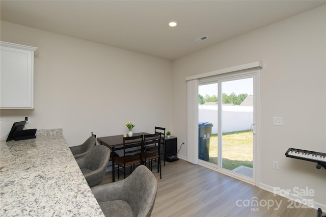 interior space featuring visible vents, recessed lighting, light wood-style flooring, and baseboards