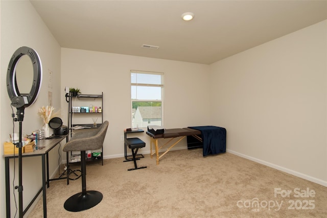carpeted home office featuring baseboards and visible vents