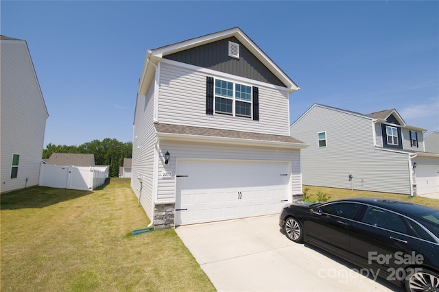 view of side of home featuring board and batten siding, driveway, a garage, fence, and a yard