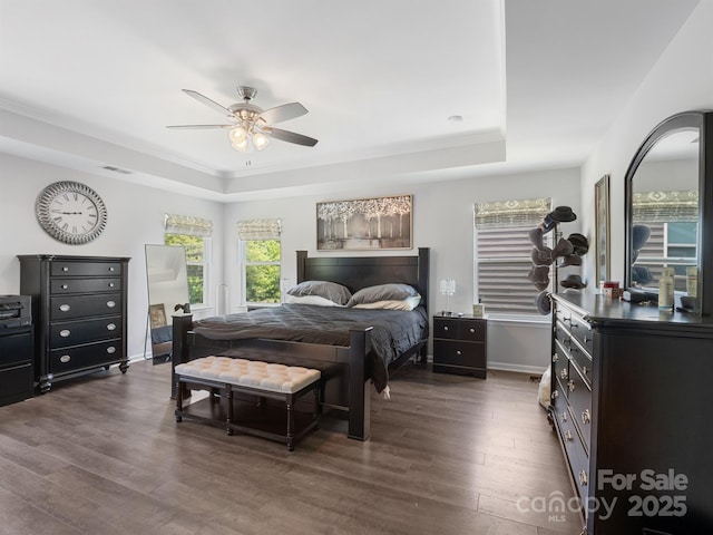 4316 Falls Lake Dr SW, Concord, NC 28025 - bedroom with a raised ceiling, dark wood-style flooring, a ceiling fan, baseboards, and crown molding