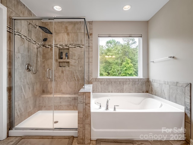 4316 Falls Lake Dr SW, Concord, NC 28025 - full bathroom featuring a garden tub, a shower stall, and recessed lighting
