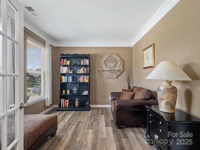 4316 Falls Lake Dr SW, Concord, NC 28025 - sitting room featuring wood finished floors, ornamental molding, and baseboards