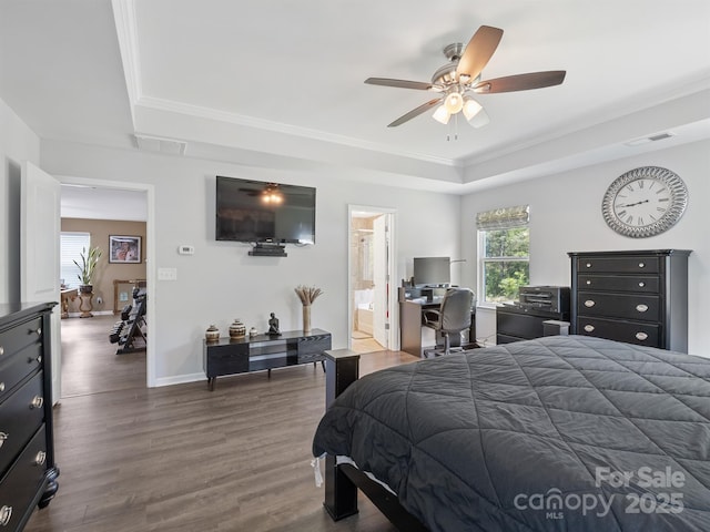 4316 Falls Lake Dr SW, Concord, NC 28025 - bedroom featuring a tray ceiling, dark wood finished floors, baseboards, ornamental molding, and ceiling fan