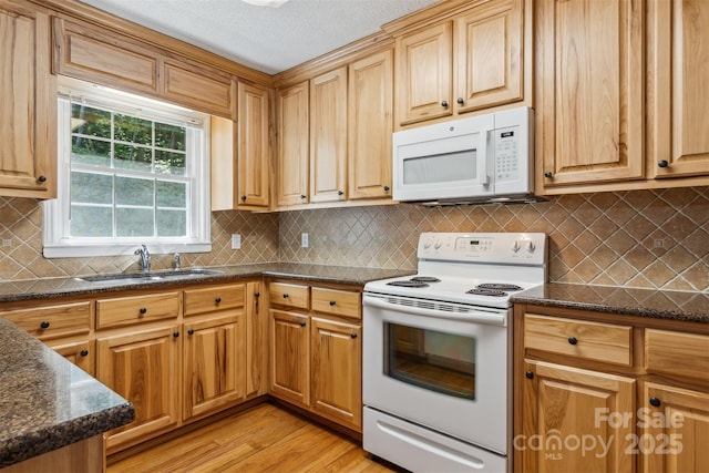 2196 Uphill Ln, Lenoir, NC 28645 - kitchen with white appliances, a sink, light wood-style flooring, and backsplash