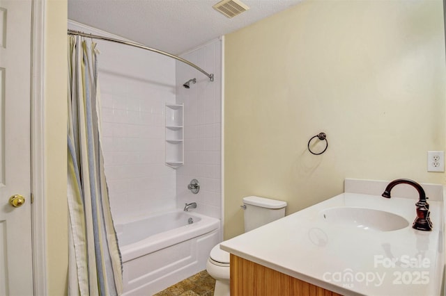 2196 Uphill Ln, Lenoir, NC 28645 - full bathroom featuring toilet, vanity, shower / tub combo with curtain, and a textured ceiling