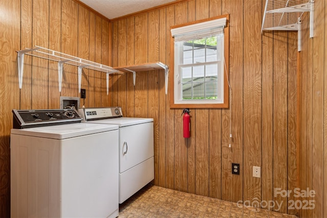 2196 Uphill Ln, Lenoir, NC 28645 - washroom featuring washer and dryer, wooden walls, tile patterned floors, and crown molding