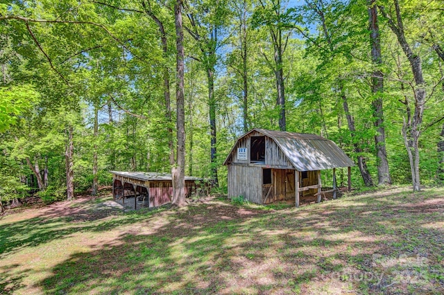 2196 Uphill Ln, Lenoir, NC 28645 - view of outbuilding featuring an outdoor structure and a forest view