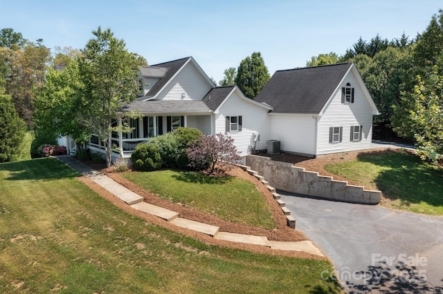 44 White Thorn Dr, Alexander, NC 28701 - view of front of home with central air condition unit and a front lawn