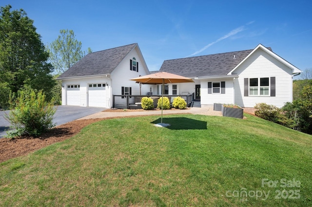 44 White Thorn Dr, Alexander, NC 28701 - view of front of house featuring roof with shingles, a wooden deck, a front yard, and aphalt driveway