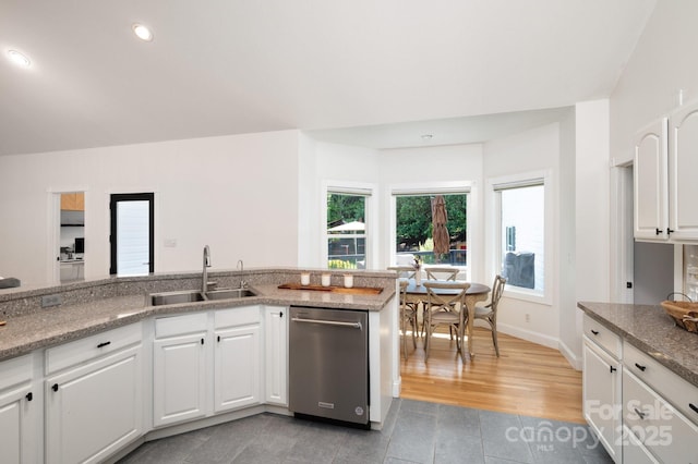 44 White Thorn Dr, Alexander, NC 28701 - kitchen with white cabinets, light stone counters, a sink, dishwasher, and light tile patterned floors