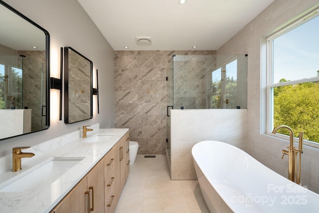 44 White Thorn Dr, Alexander, NC 28701 - full bath with tile walls, plenty of natural light, and a sink