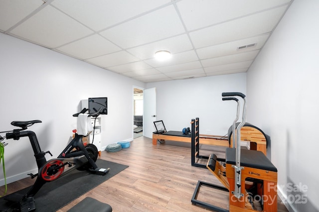 44 White Thorn Dr, Alexander, NC 28701 - exercise area with baseboards, light wood finished floors, a paneled ceiling, and visible vents