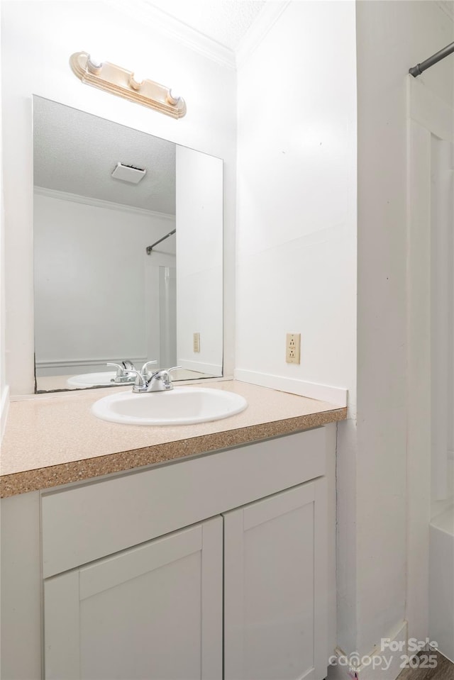 819 W Rankin Ave, Gastonia, NC 28052 - full bathroom featuring crown molding, vanity, and walk in shower