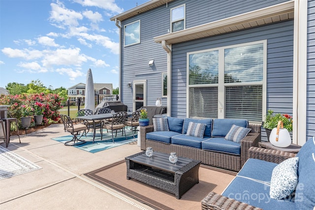 view of patio with outdoor lounge area and outdoor dining area