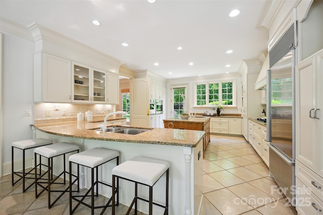 5701 Challisford Ln, Charlotte, NC 28226 - kitchen featuring a sink, ornamental molding, and stainless steel appliances