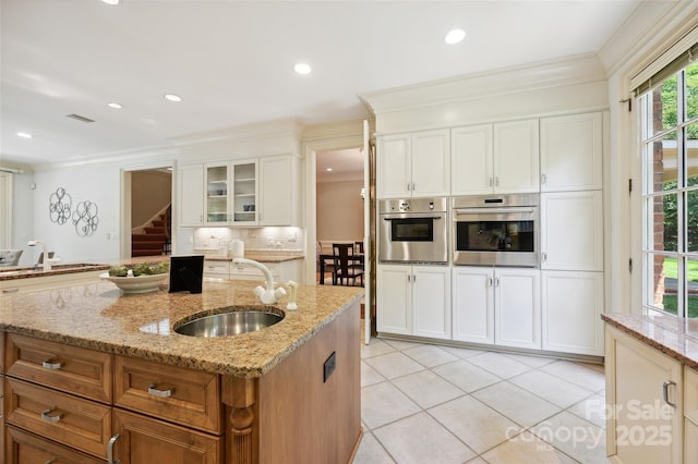 5701 Challisford Ln, Charlotte, NC 28226 - kitchen with ornamental molding, decorative backsplash, a sink, and oven