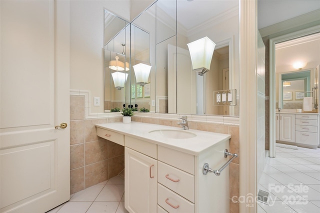 5701 Challisford Ln, Charlotte, NC 28226 - bathroom with crown molding, vanity, tile patterned floors, and tile walls