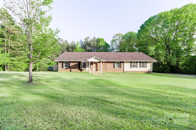 single story home with a front yard