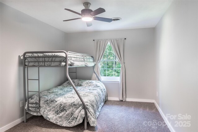 bedroom with carpet floors, baseboards, visible vents, and ceiling fan