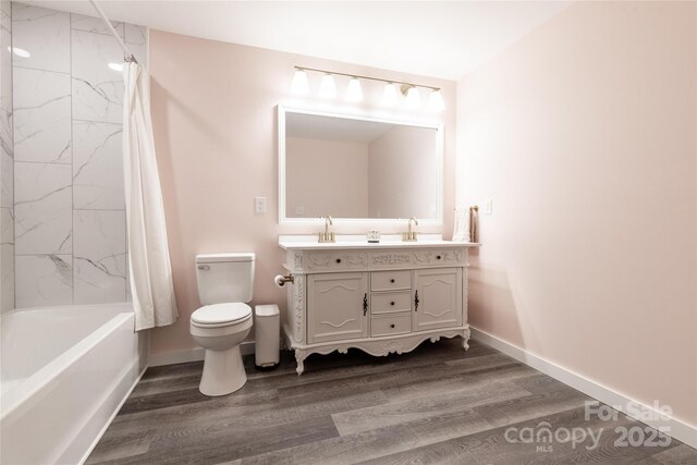 full bathroom with toilet, shower / bath combination with curtain, wood finished floors, and vanity