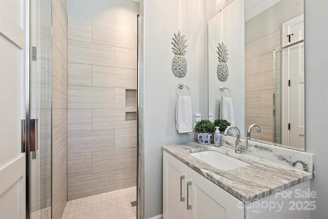 full bath featuring a stall shower and vanity