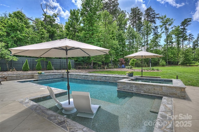 view of swimming pool featuring a yard, a fenced in pool, a patio area, an in ground hot tub, and a fenced backyard