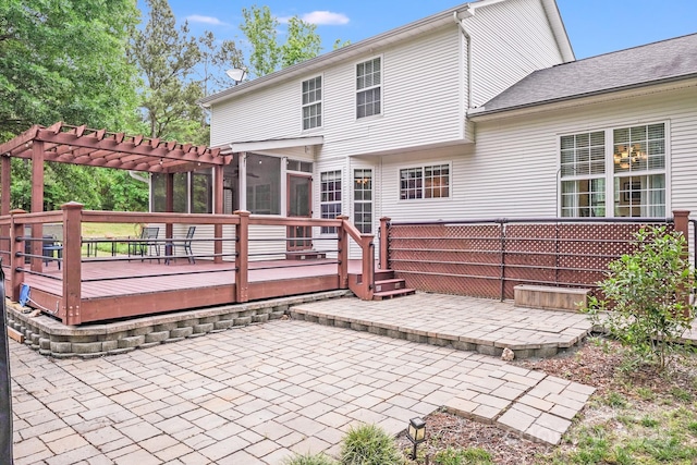 6910 Birdsong Ln, Waxhaw, NC 28173 - back of house with a sunroom, a pergola, a patio, and a wooden deck