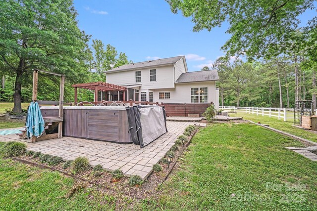 6910 Birdsong Ln, Waxhaw, NC 28173 - back of house featuring a hot tub, a patio area, and a pergola