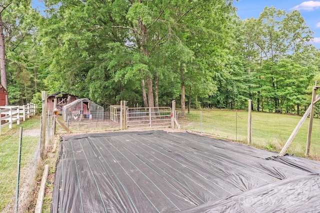 6910 Birdsong Ln, Waxhaw, NC 28173 - deck with view of wooded area and an outdoor structure