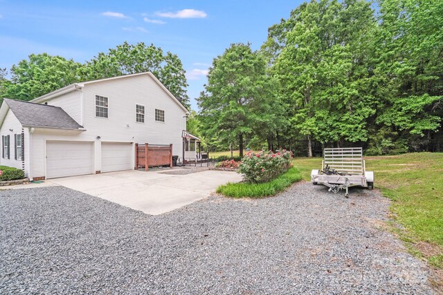 6910 Birdsong Ln, Waxhaw, NC 28173 - view of property exterior featuring driveway and a garage