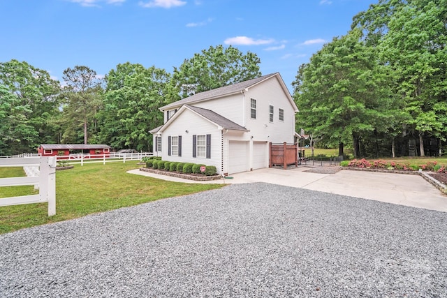 6910 Birdsong Ln, Waxhaw, NC 28173 - view of property exterior with an attached garage, driveway, and view of wooded area