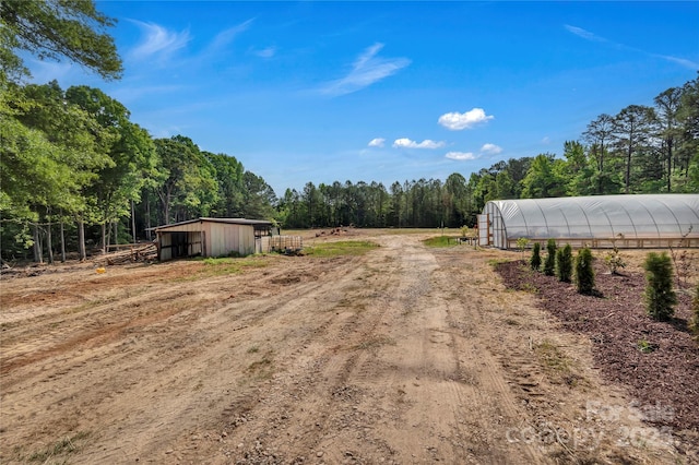 159 Old Home Pl, China Grove, NC 28023 - view of street with an exterior structure, driveway, and a rural view