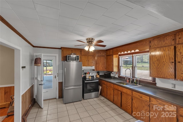 159 Old Home Pl, China Grove, NC 28023 - kitchen featuring a sink, brown cabinets, dark countertops, and stainless steel appliances