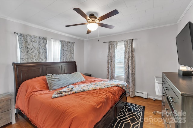 159 Old Home Pl, China Grove, NC 28023 - bedroom with ceiling fan, ornamental molding, baseboard heating, and wood finished floors
