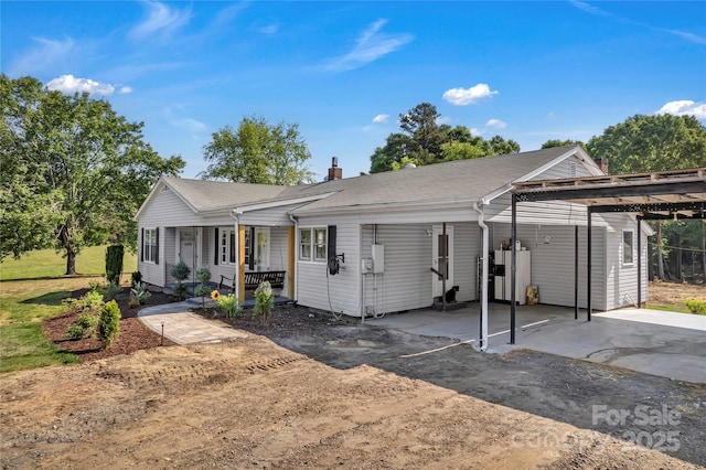 159 Old Home Pl, China Grove, NC 28023 - single story home with covered porch, driveway, a chimney, and an attached carport