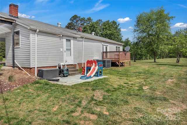 159 Old Home Pl, China Grove, NC 28023 - back of house featuring a chimney, a lawn, a deck, a patio area, and entry steps