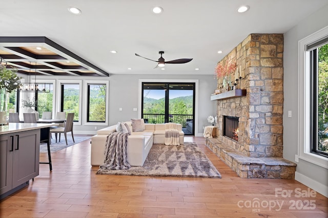 living room with recessed lighting, a ceiling fan, and baseboards