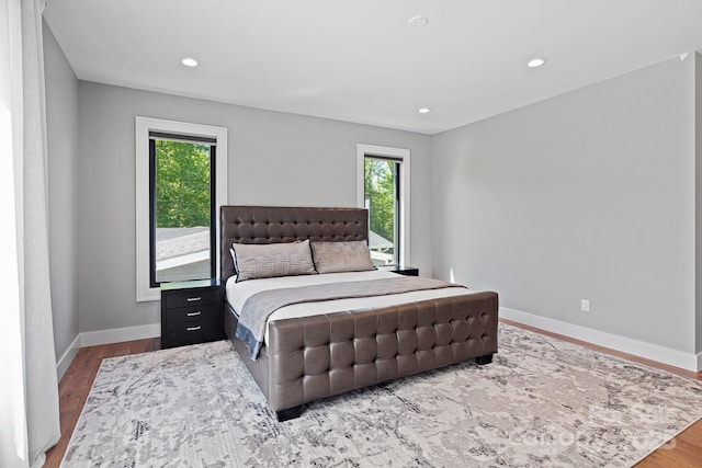 bedroom featuring recessed lighting, baseboards, and wood finished floors