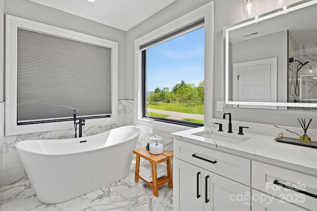 bathroom with visible vents, tile walls, marble finish floor, and vanity