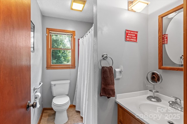 204 Triplett St, Jonesville, NC 28642 - full bathroom featuring vanity, a textured ceiling, and toilet