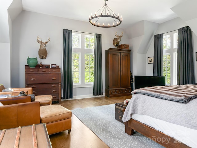 341 Vanderbilt Rd, Asheville, NC 28803 - bedroom with a chandelier, multiple windows, and lofted ceiling