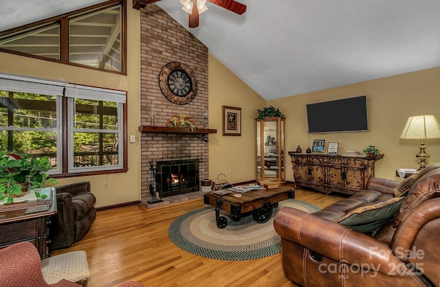 385 N Fork Rd, Black Mountain, NC 28711 - living area featuring a brick fireplace, baseboards, ceiling fan, high vaulted ceiling, and light wood-type flooring