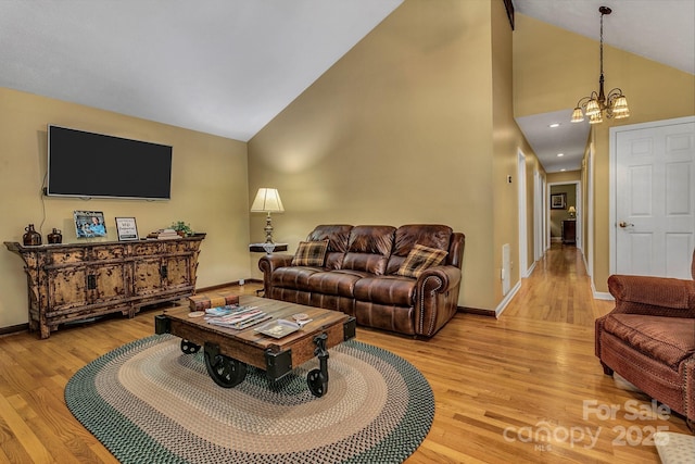 385 N Fork Rd, Black Mountain, NC 28711 - living area featuring baseboards, a chandelier, light wood finished floors, and high vaulted ceiling