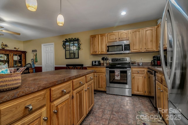 385 N Fork Rd, Black Mountain, NC 28711 - kitchen with dark countertops, stainless steel appliances, decorative light fixtures, stone finish flooring, and a ceiling fan