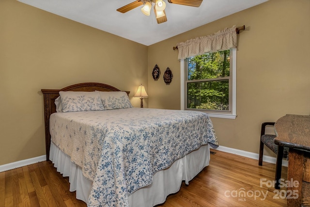 385 N Fork Rd, Black Mountain, NC 28711 - bedroom with a ceiling fan, baseboards, and wood finished floors