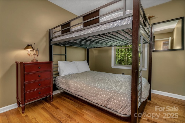 385 N Fork Rd, Black Mountain, NC 28711 - bedroom featuring baseboards and wood finished floors