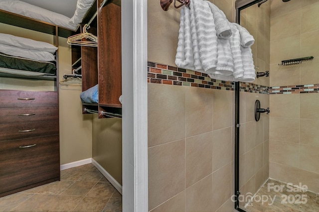 385 N Fork Rd, Black Mountain, NC 28711 - bathroom featuring baseboards and a shower stall